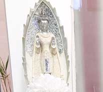 A silver coloured idol of deity placed in Radiance Aesthetic Clinic